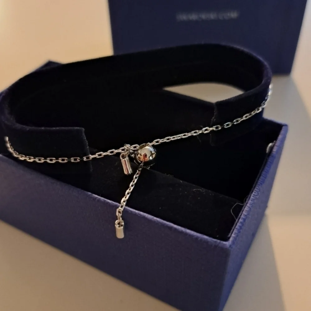NIB Swarovski Simple Rhodium Adjustable Disc Chain Slide Bracelet